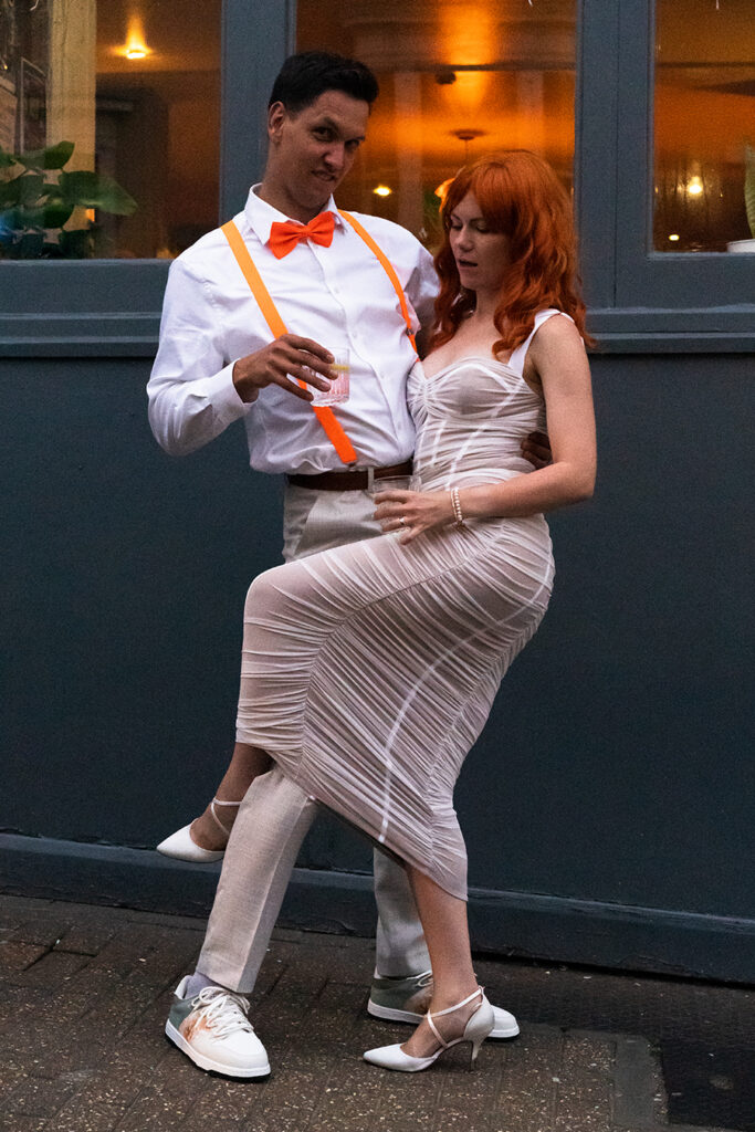 Bride and groom at the evening reception dressed in the theme of The fifth element film