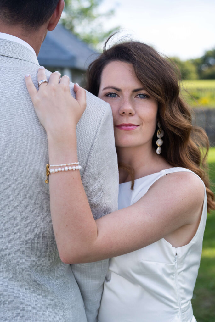 A beautiful bride holding on to her new husband