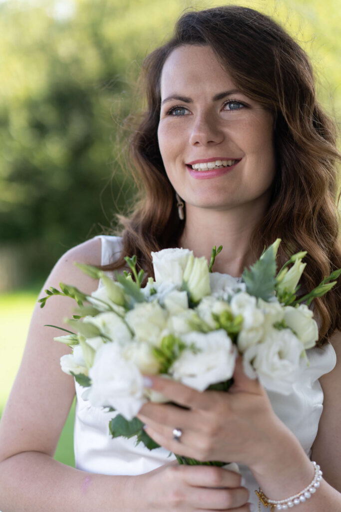 A bridal portrait with white bouquet