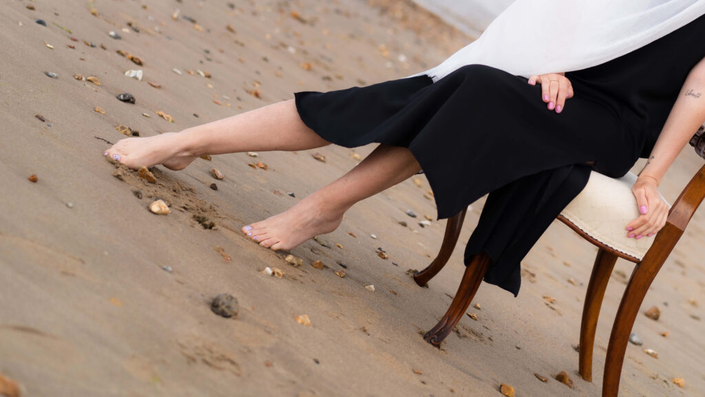 elegant beach photo featuring woman's legs