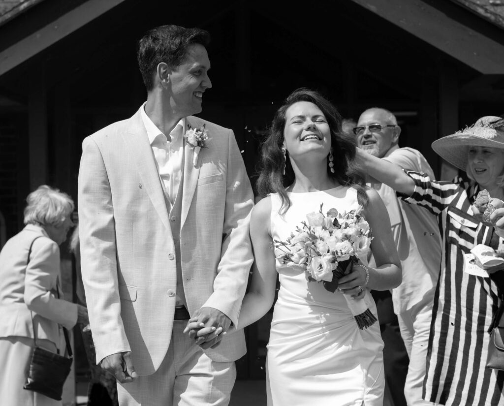 A black and white photograph of a newly married couple