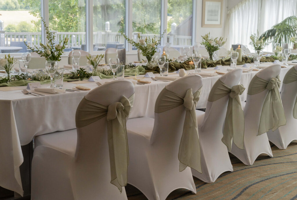 White and sage wedding reception decoration