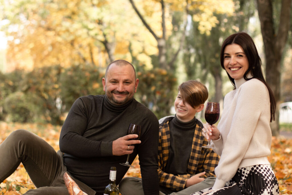 a family having a picnic in the Autumn park