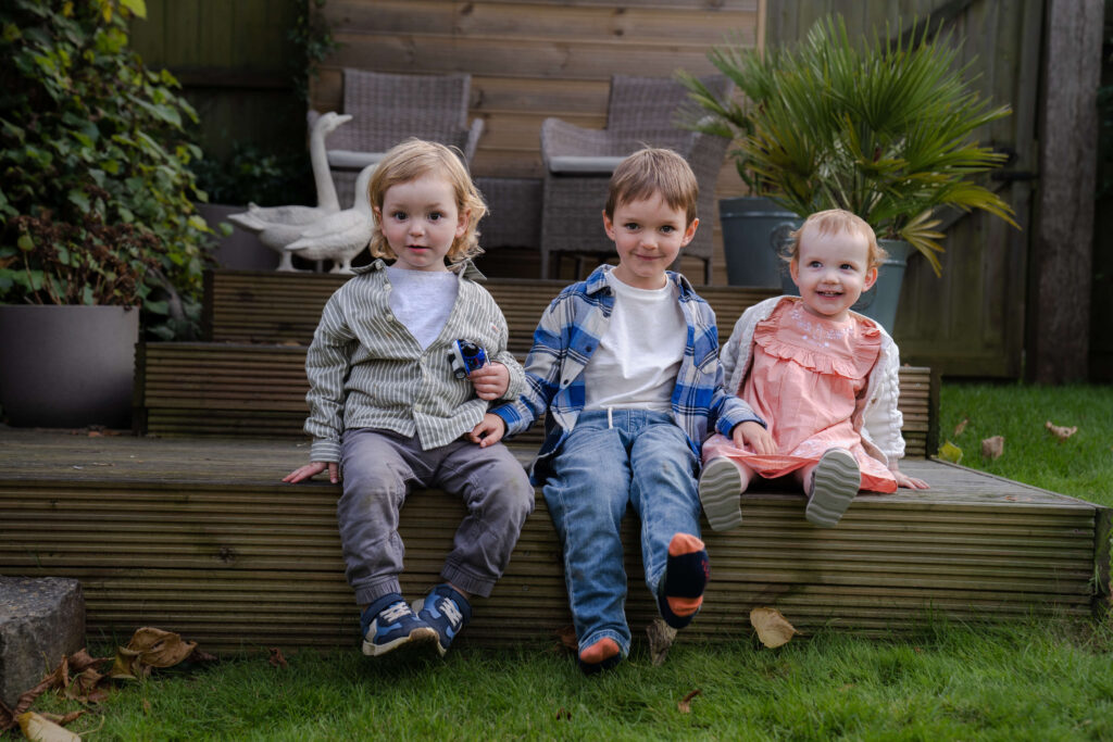 A family portrait of three children on the Isle of Wight
